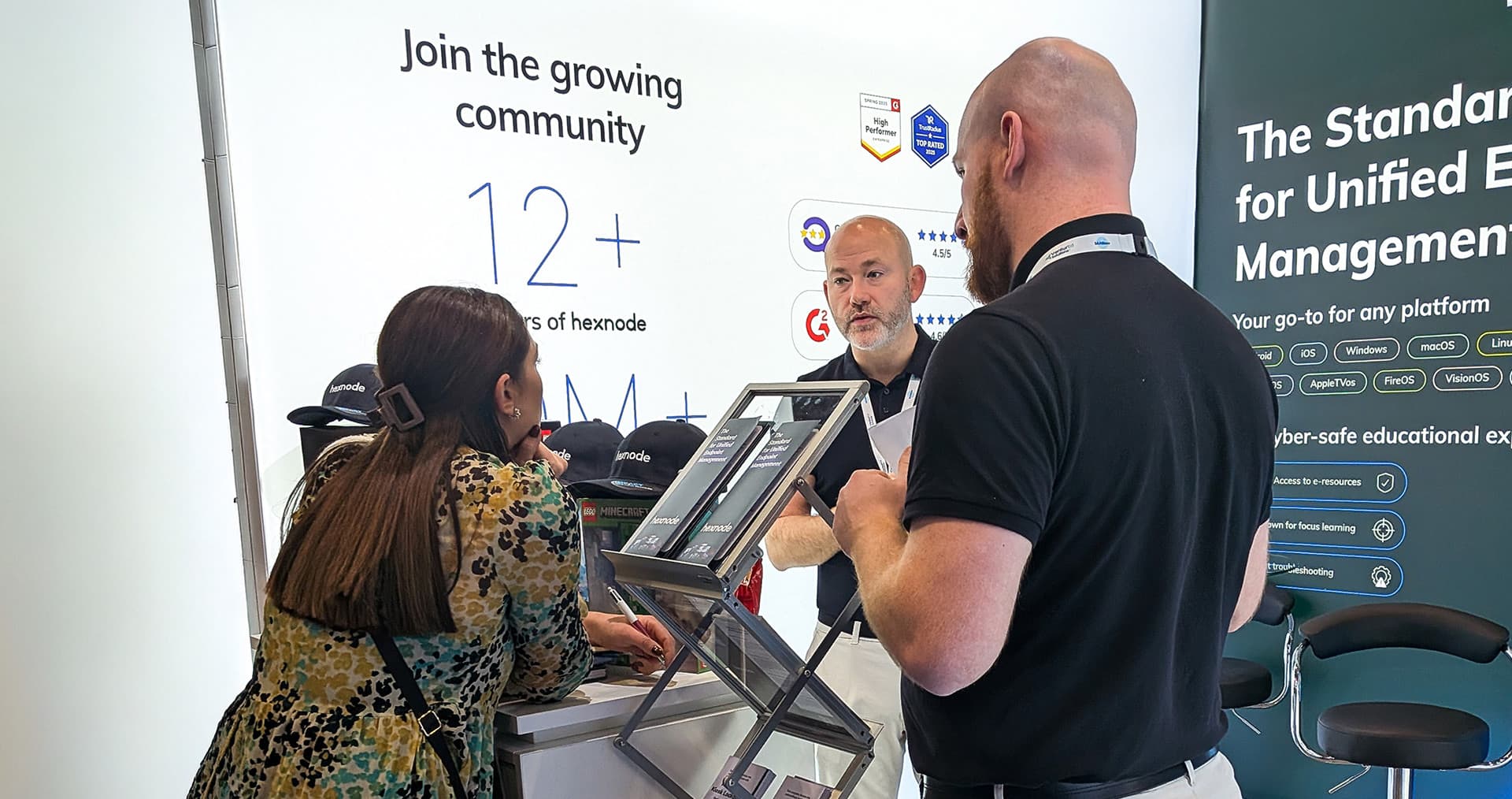 Hexnode's sales executive interacting with attendees at SAA Show 2025