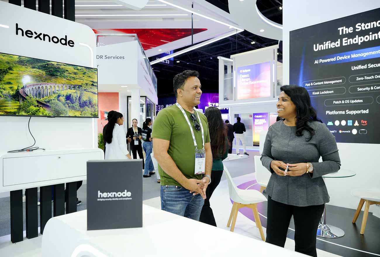 Hexnode's sales executive interacting with attendees at GITEX 2025