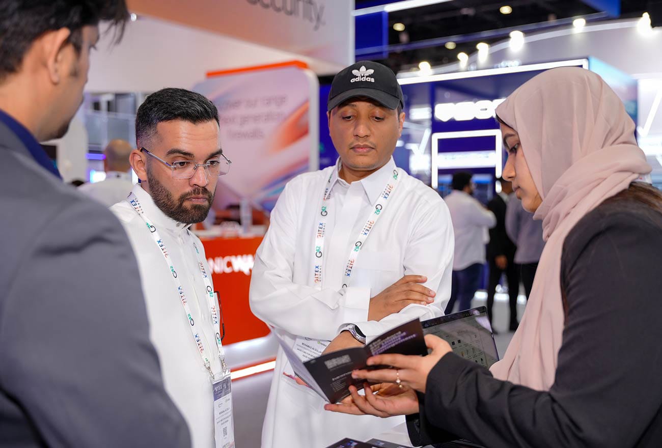 Hexnode's sales executive interacting with attendees at GITEX 2025