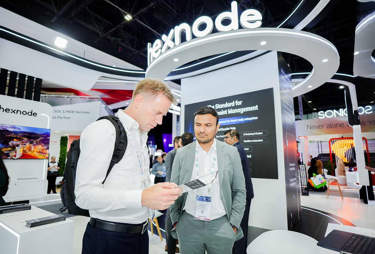 Hexnode's sales executive interacting with attendees at GITEX 2025
