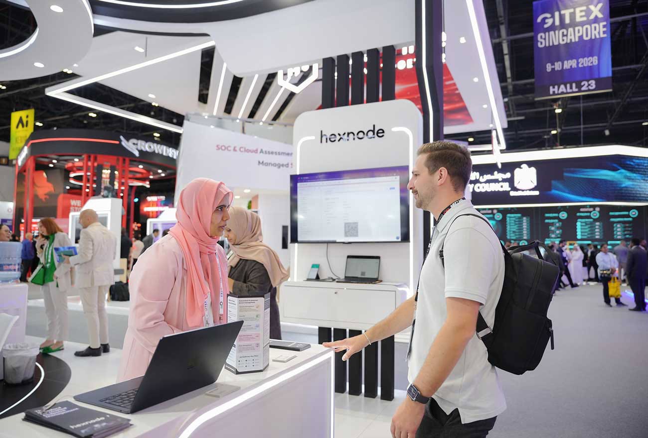 Hexnode's sales executive interacting with attendees at GITEX 2025