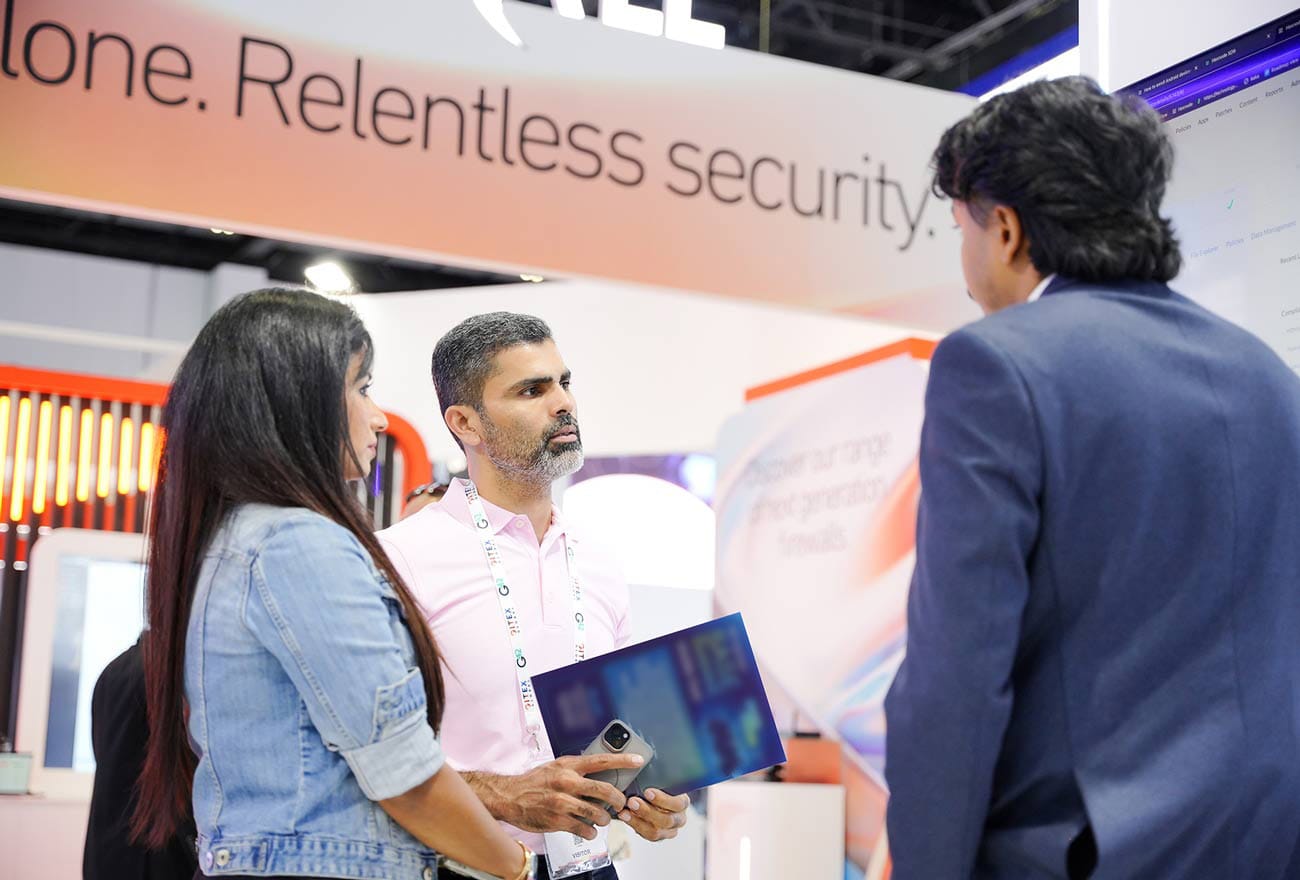 Hexnode's sales executive interacting with attendees at GITEX 2025