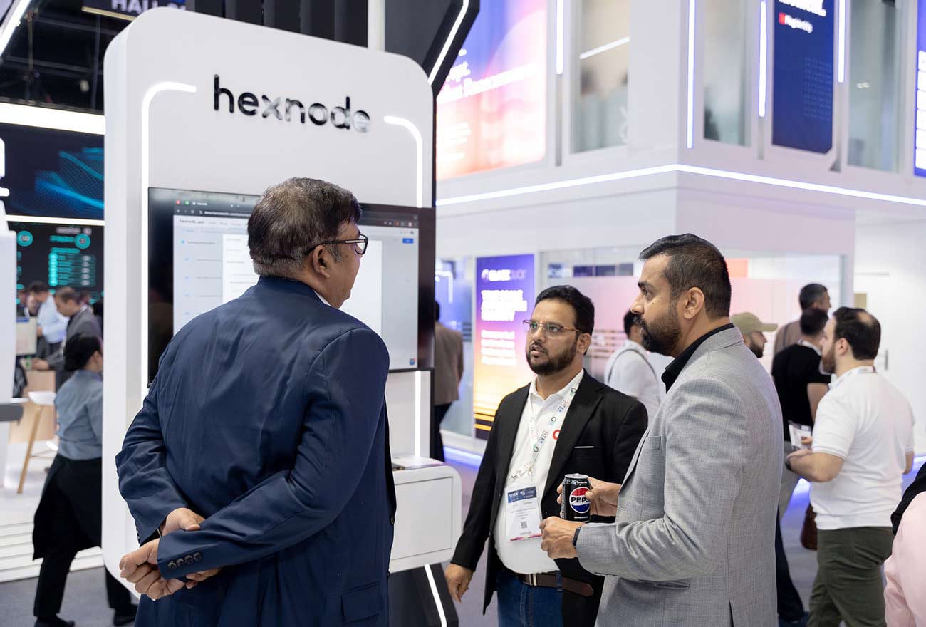Hexnode's sales executive interacting with attendees at GITEX 2025