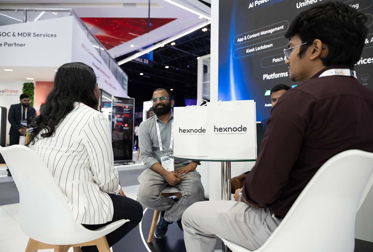Hexnode's sales executive interacting with attendees at GITEX 2025