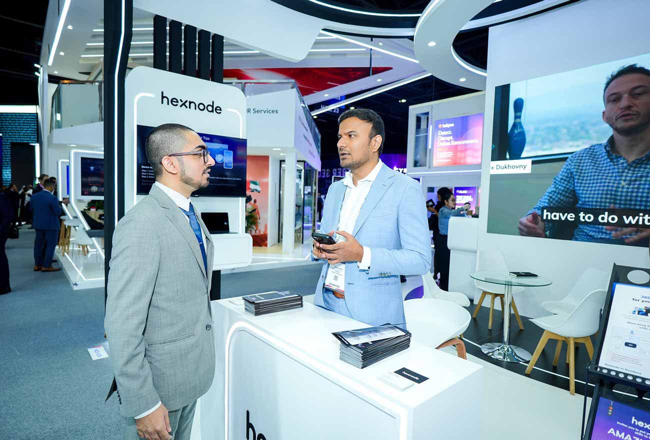 Hexnode's sales executive interacting with attendees at GITEX 2025