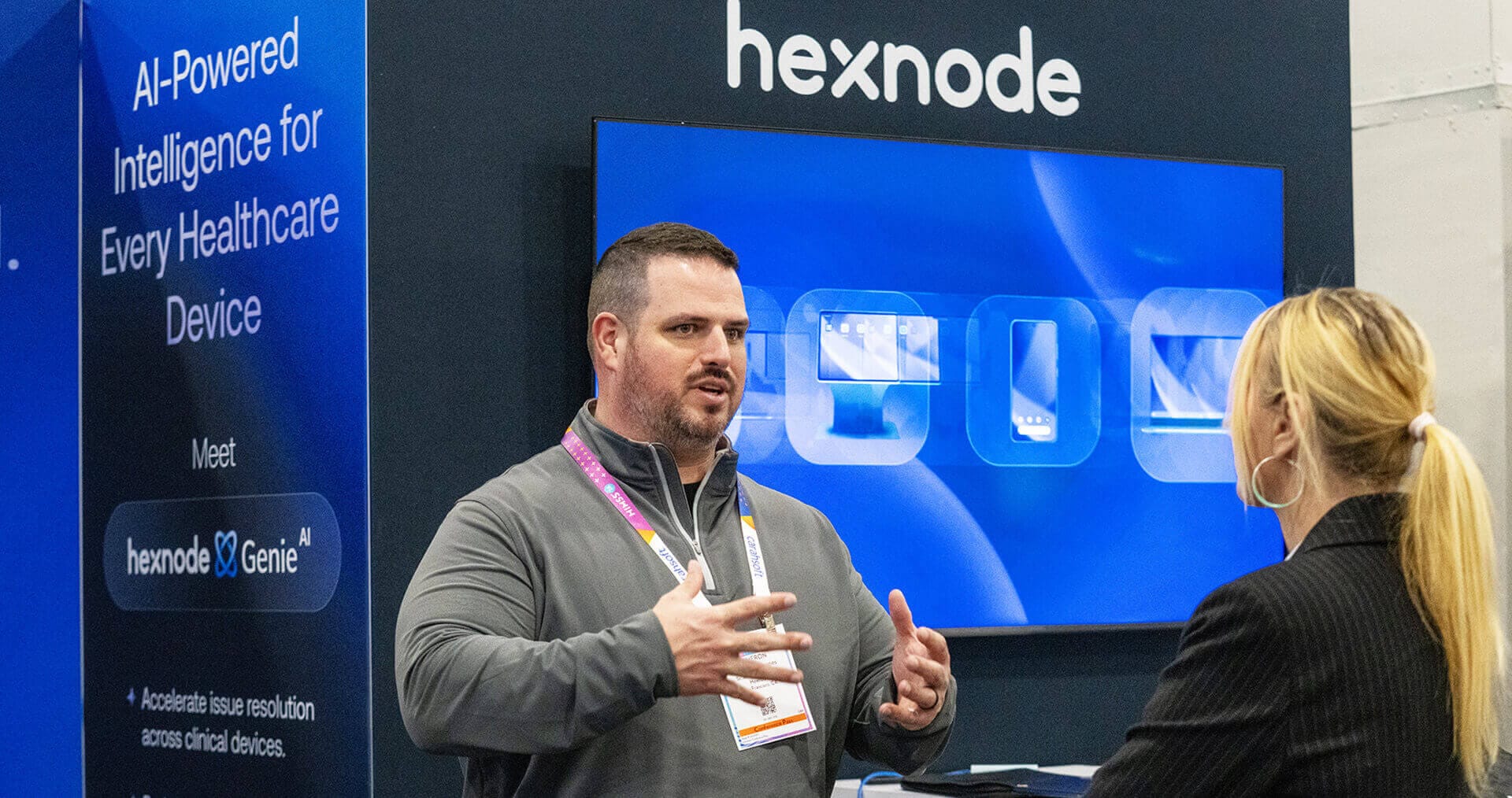 Hexnode sales executive with a customer at HIMSS26
