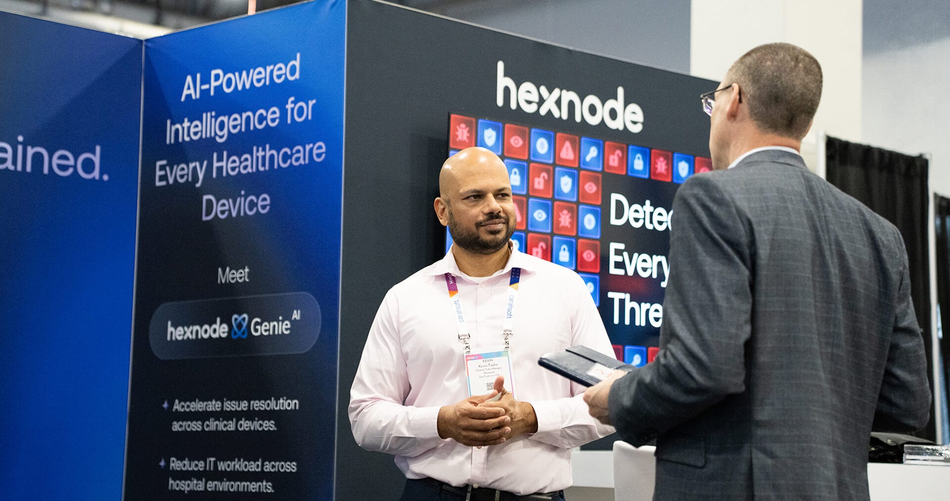 Hexnode sales executive with a customer at HIMSS26