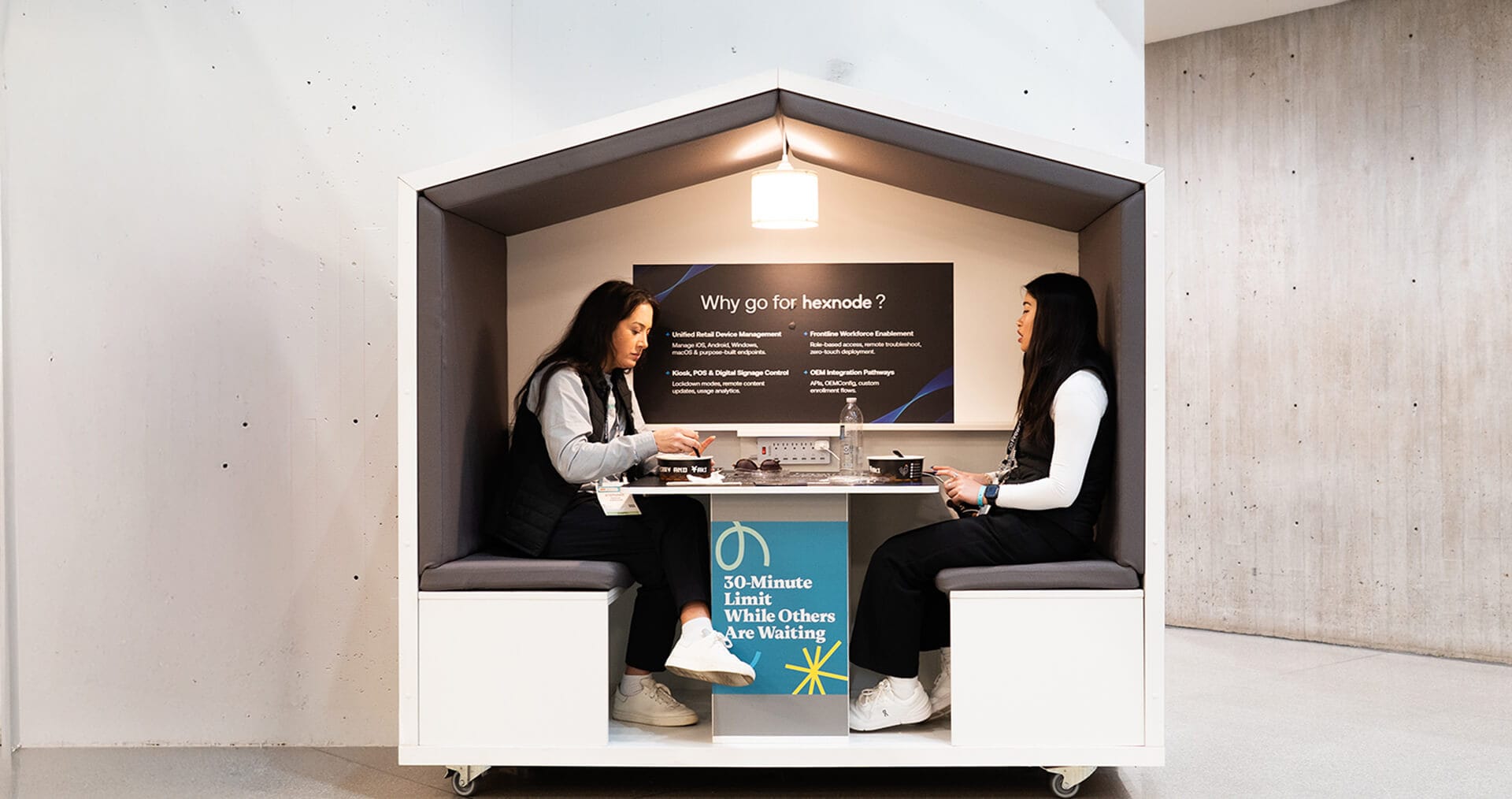 Hexnode sales executive with a customer at NRF2026