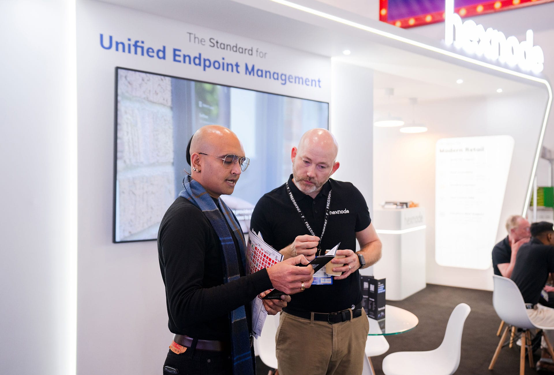 Hexnode sales executive with a customer at RTS25