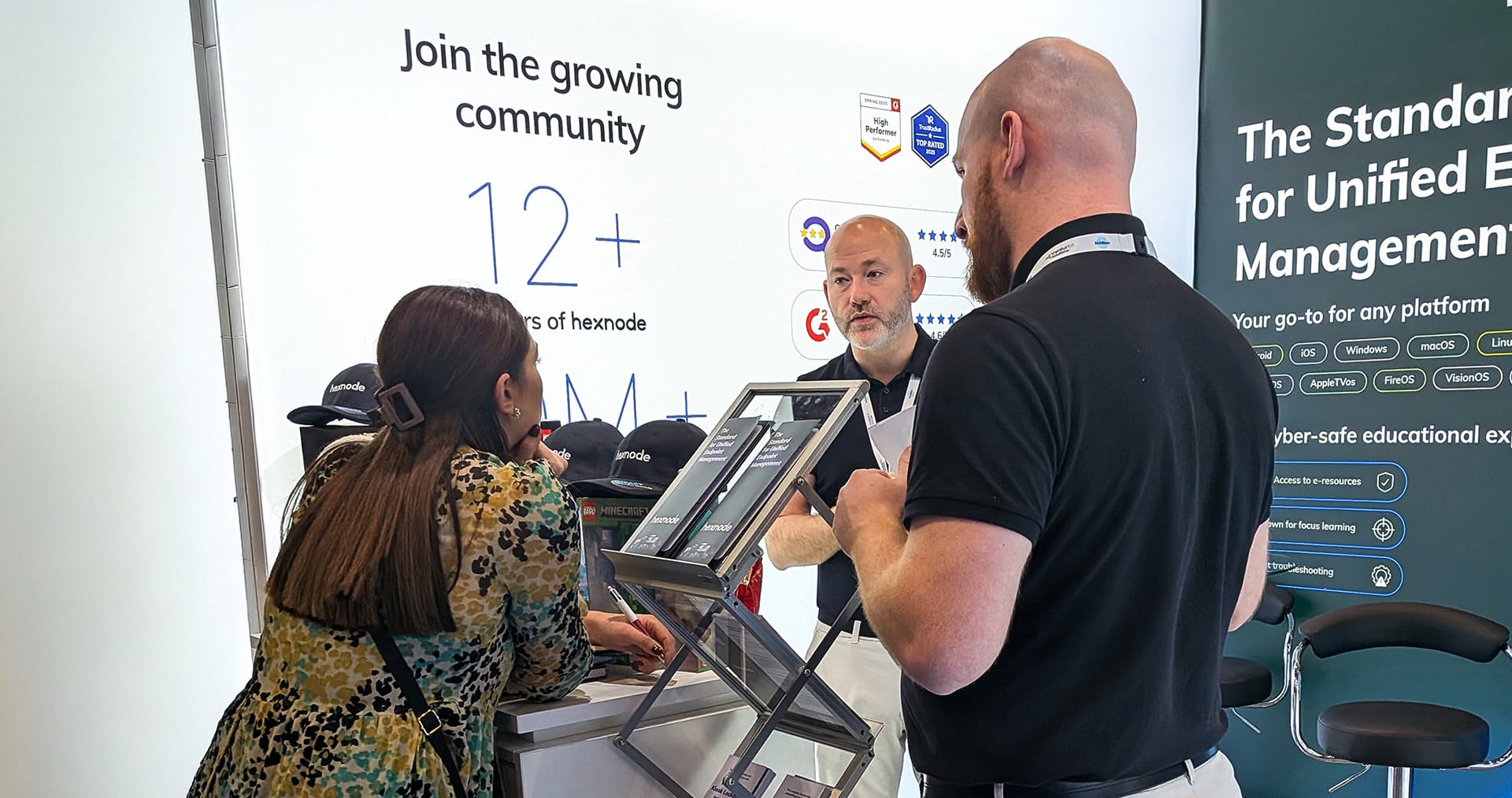 Hexnode's sales executive interacting with attendees at SAA Show 2025