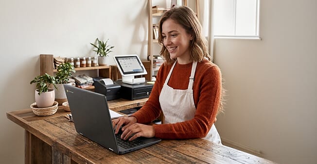 Retail worker using a ChromeOS device managed with Hexnode for secure operations and business application access
