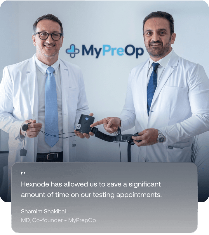 Doctors using a connected medical device in a clinic, managed with Hexnode UEM for healthcare.