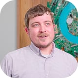 Profile picture of Benjamin Dunham next to a customer testimonial about Hexnode's easy deployment and device onboarding.