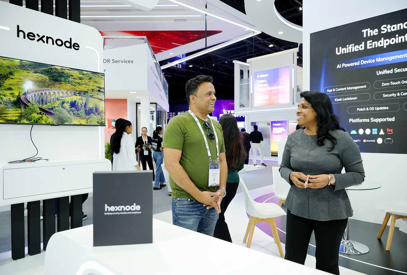 Hexnode's sales executive interacting with attendees at GITEX 2025