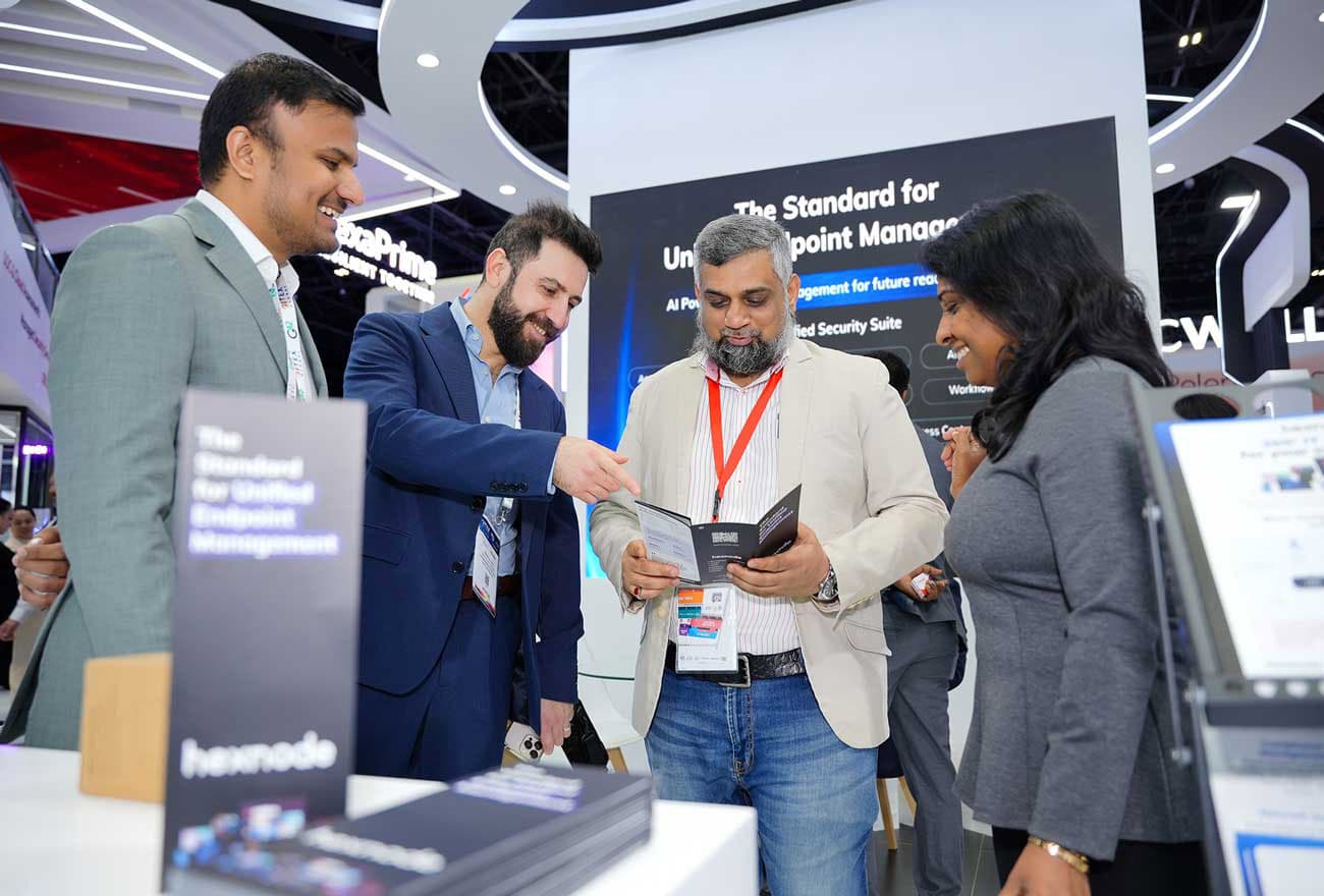 Hexnode's sales executive interacting with attendees at GITEX 2025