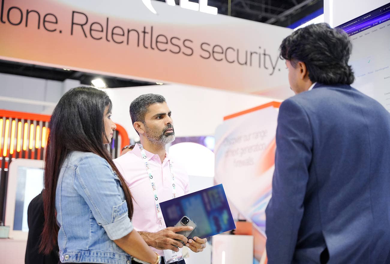 Hexnode's sales executive interacting with attendees at GITEX 2025