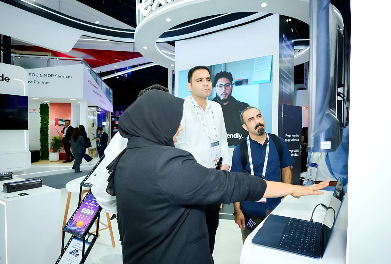 Hexnode's sales executive interacting with attendees at GITEX 2025