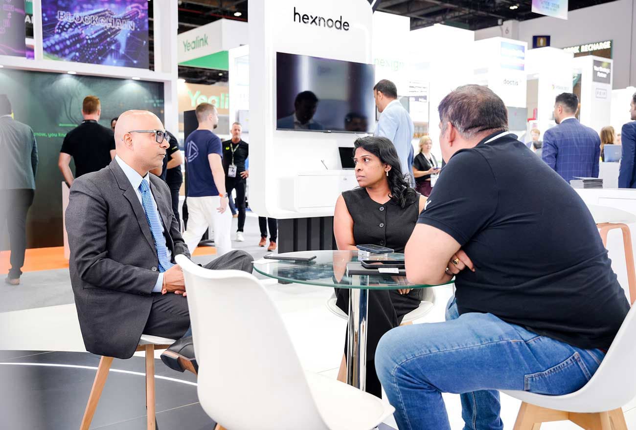 Hexnode's sales executive interacting with attendees at GITEX 2025