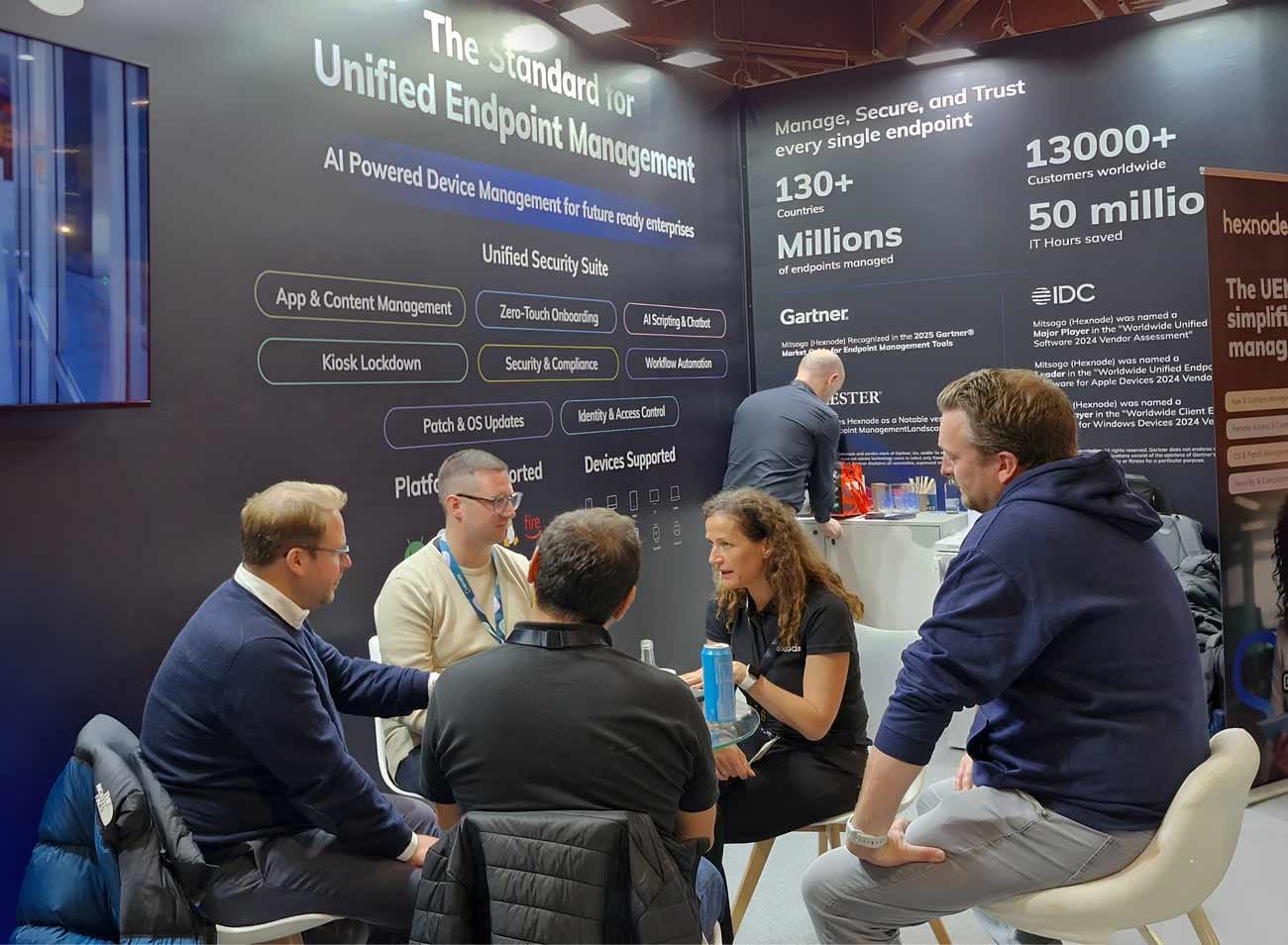 Hexnode's sales executive interacting with attendees at it-sa 2025