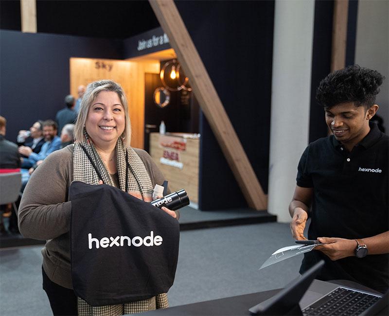 Hexnode customer with a swag bag at MWC23