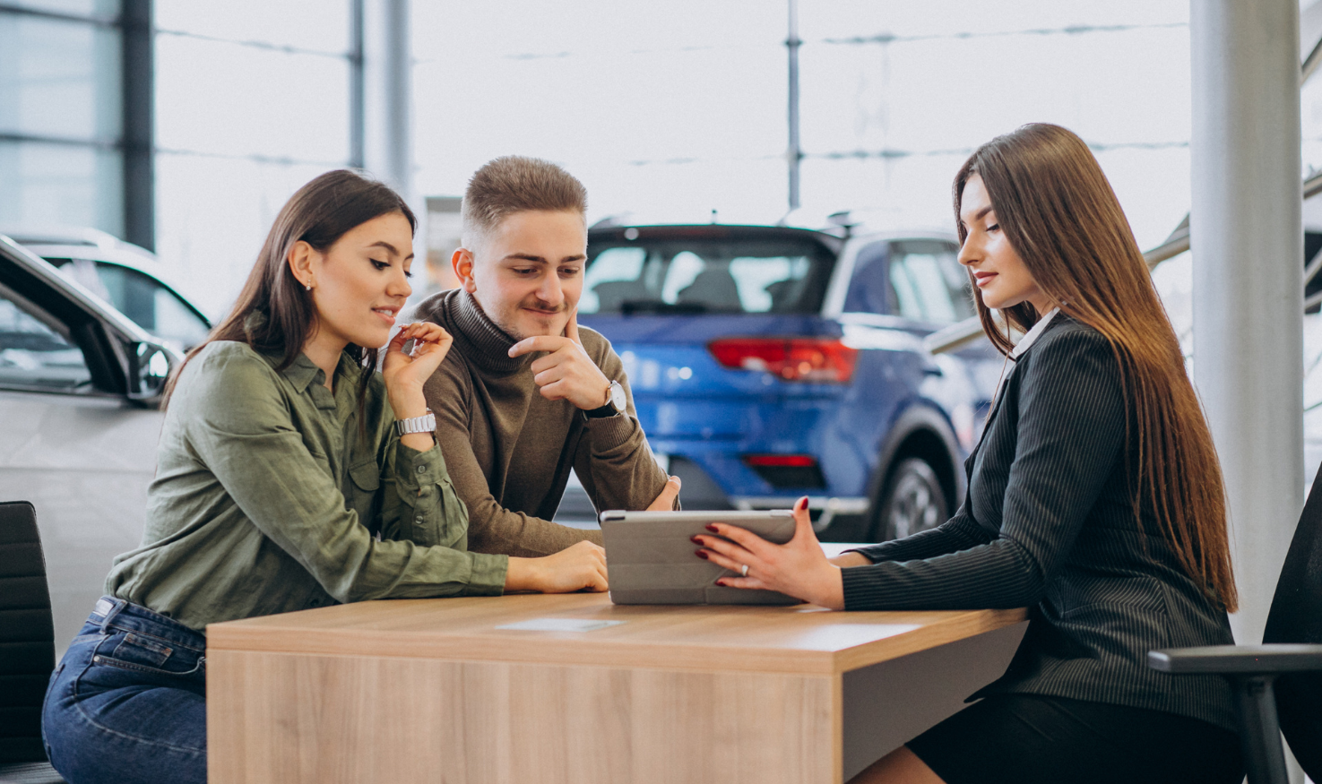 Customers in a car showroom